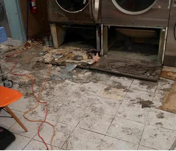 Commercial dryers start fire and cause damage.