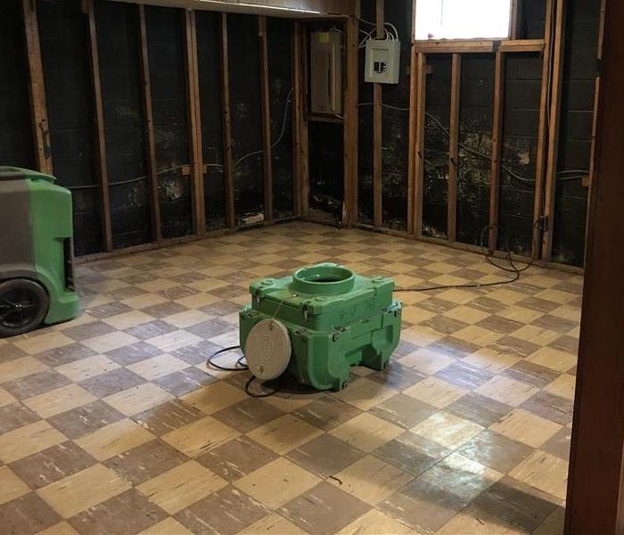 SERVPRO drying machines and dry basement floor