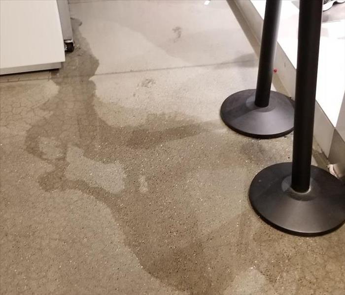 Water damage on retail store floor.