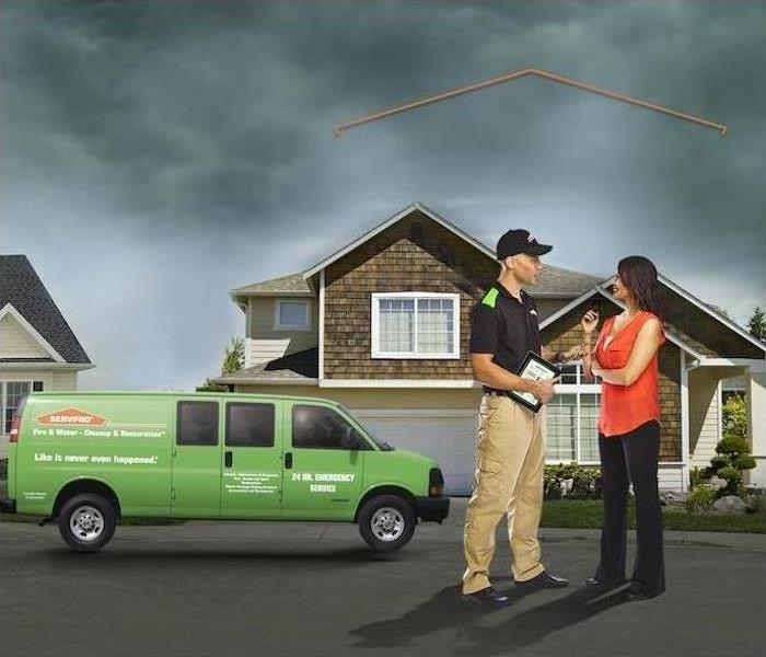 SERVPRO Technician talking to client.